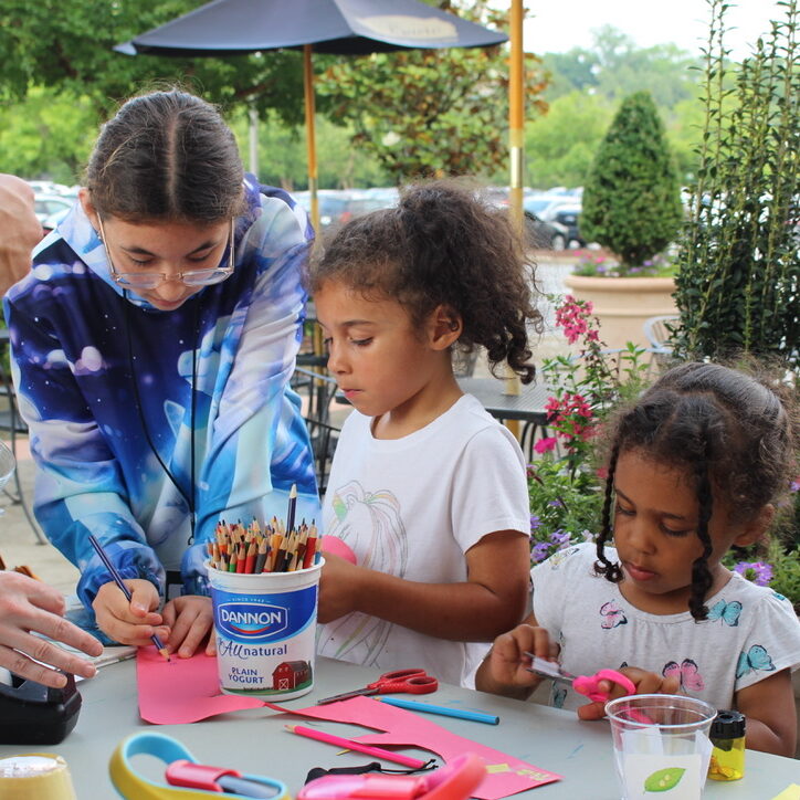 Children coloring in garden